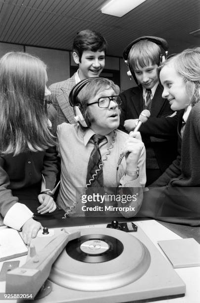Ed Doolan BRMB Radio Disc Jockey, pictured with news boys and girls, Birmingham, 14th January 1975.