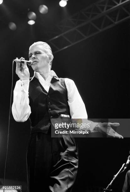 British pop singer David Bowie performing on stage during the first of six concerts at the Empire Pool, Wembley, dressed in a Dolce Vita outfit as...