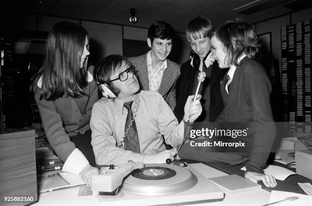 Ed Doolan BRMB Radio Disc Jockey, pictured with news boys and girls, Birmingham, 14th January 1975.