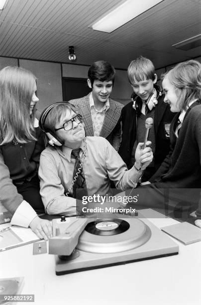 Ed Doolan BRMB Radio Disc Jockey, pictured with news boys and girls, Birmingham, 14th January 1975.