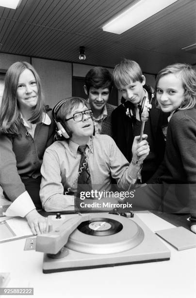 Ed Doolan BRMB Radio Disc Jockey, pictured with news boys and girls, Birmingham, 14th January 1975.