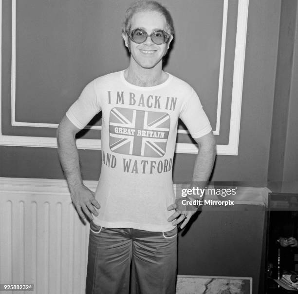 Elton John returns from America to announce that he is back in Britain for good, picture taken 6th December 1974.