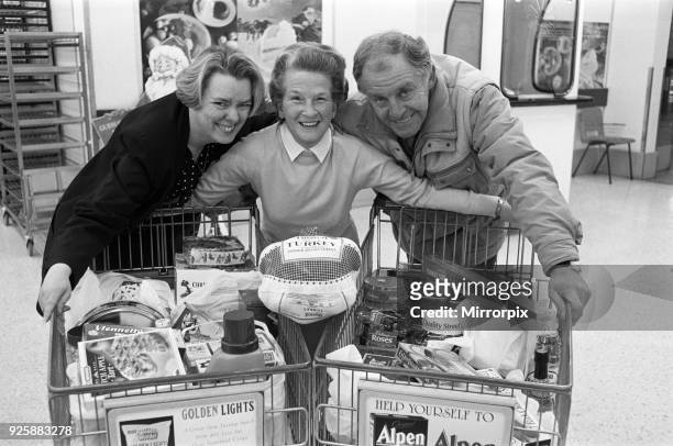 Trolley dash winner Marjorie Stansfield pictured with Susan Wilkinson of ASDA and Lions President Gerlad Higginson at ASDA Birkby, 11th December 1991.