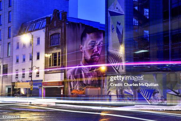Mural by the artist 'Smug One' known locally as the chef and the lobster looms large on March 1, 2018 in Belfast, Northern Ireland. The striking...