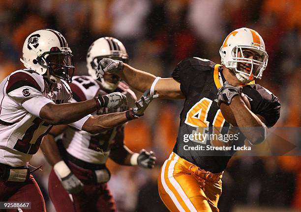 Chris Culliver of the South Carolina Gamecocks tries to stop Austin Johnson of the Tennessee Volunteers as he breaks away for a touchdown at Neyland...