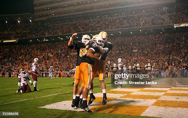 Kevin Cooper of the Tennessee Volunteers celebrates with teammates after scoring a touchdown against the South Carolina Gamecocks at Neyland Stadium...