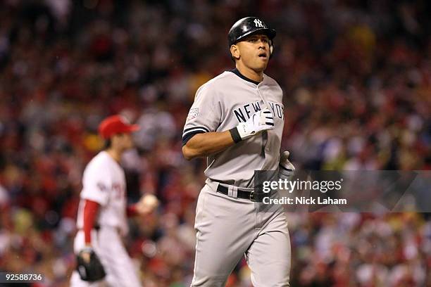 Alex Rodriguez of the New York Yankees runs to first after being hit by a pitch Cole Hamels of the Philadelphia Phillies in Game Three of the 2009...