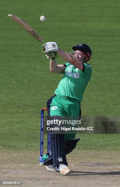 Niall O'Brien of Ireland hits out during the ICC Cricket World Cup Qualifier Warm Up between Scotland and Ireland at Queen's Sports Club on March 1,...