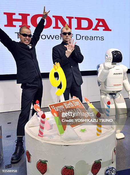 Ketch and Hiro-pon , members of the Japanese pantomime group Gamarjobat, take part in a promotional ninth birthday party for Japanese auto giant...