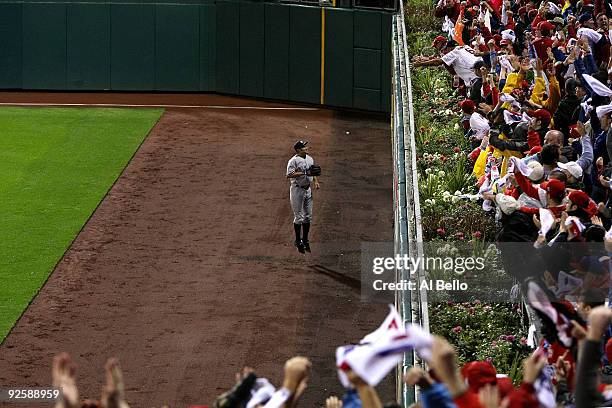 Johnny Damon of the New York Yankees watches as a Jayson Werth home run goes over the fence against the Philadelphia Phillies in Game Three of the...