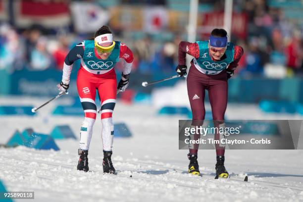 Heidi Weng of Norway and Anastasia Sedova an Olympic Athlete of Russia in action during the Cross-Country Skiing - Ladies' 30km Mass Start Classic at...