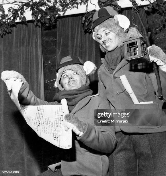 Two carol singing field mice in a scene from 'Toad of Toad Hall' which ends at the Everyman Theatre tonight, 28th December 1964.