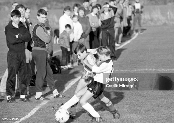 Schoolboys playing football, Nunthorpe and Hemlington battle for possession in the Minor League, 12th November 1988.