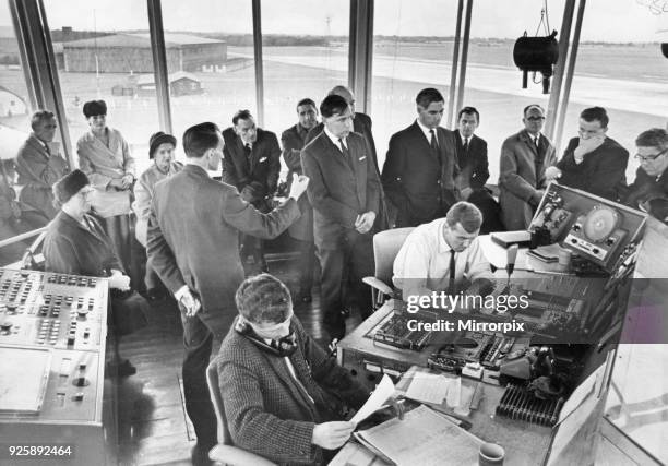 Members of the town urban council get a close up view of the inside of the control tower at Teesside Airport, during a tour of inspection. They were...