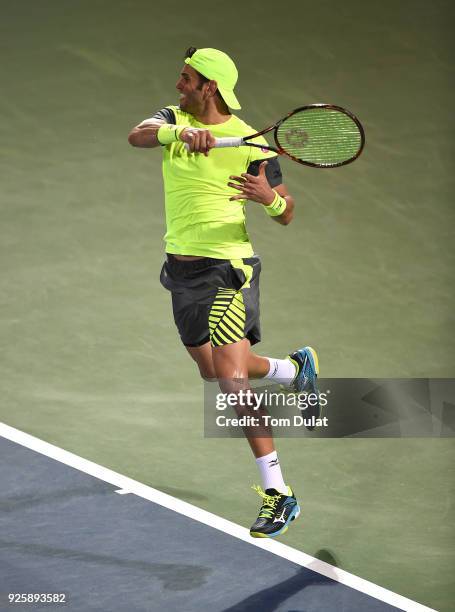 Malek Jaziri of Tunisia returns a shot during his quarter final match against Stefanos Tsitsipas of Greece on day four of the ATP Dubai Duty Free...