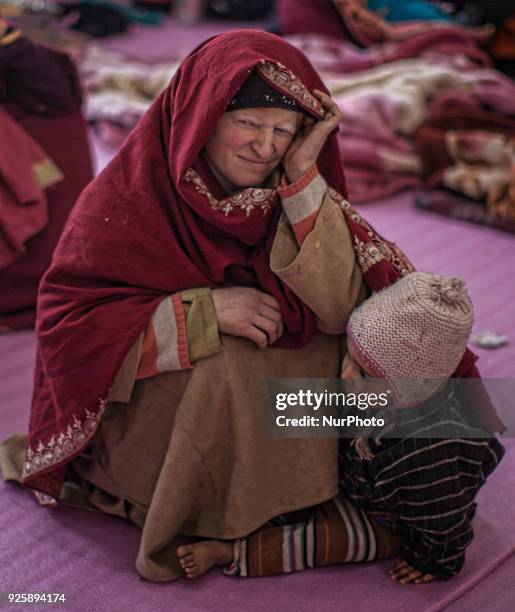 Displaced Kashmiris take shelter in a government school during a fresh skirmish along the border on February 27, 2018 in Uri, 120 Kms north west of...