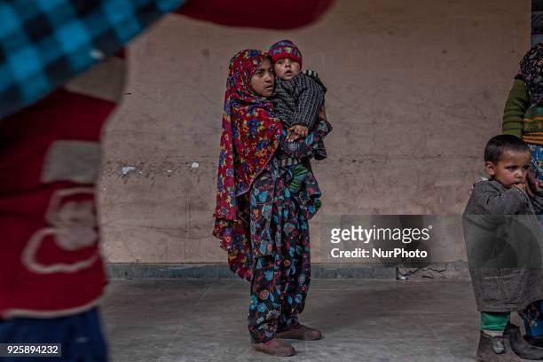 Displaced Kashmiri children take shelter in a government school during a fresh skirmish along the border on February 27, 2018 in Uri, 120 Kms north...