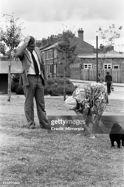 Ninety two year old supergran Winifried Ali gives a demonstration of her ability to complete a few press-ups watched by health boss Tony Richardson....