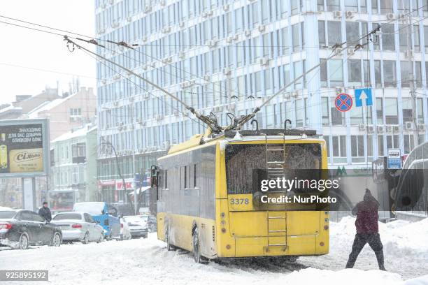 Driver repair his trolley bus during the snowfall in Kyiv, Ukraine, Mar. 1, 2018. Transport collapse appears in Kyiv, as city was hit with a heavy...