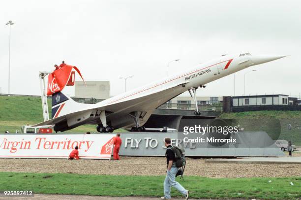 Virgin Group staff hijacking the British Airways Concorde model that stands at the entrance to the tunnel and changed the livery to Virgi on the day...