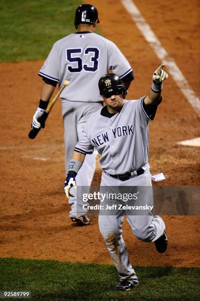 Nick Swisher of the New York Yankees celebrates his home run in the top of the sixth inning against the Philadelphia Phillies in Game Three of the...