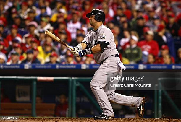 Nick Swisher of the New York Yankees connects for a home run in the top of the sixth inning against the Philadelphia Phillies in Game Three of the...