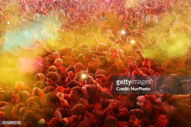 Devotees play with colors on the occasion of Holi festival celebration at historical Govind Dev Ji temple , in Jaipur, Rajasthan, India on 01...