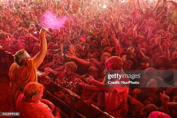 Devotees play with colors on the occasion of Holi festival celebration at historical Govind Dev Ji temple , in Jaipur, Rajasthan, India on 01...