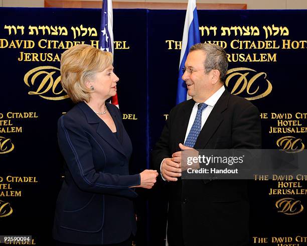 In this handout image supplied by the U.S. Embassy in Tel Aviv, Secretary of State Hillary Clinton meets with Israeli Minister of Defense Ehud Barak...