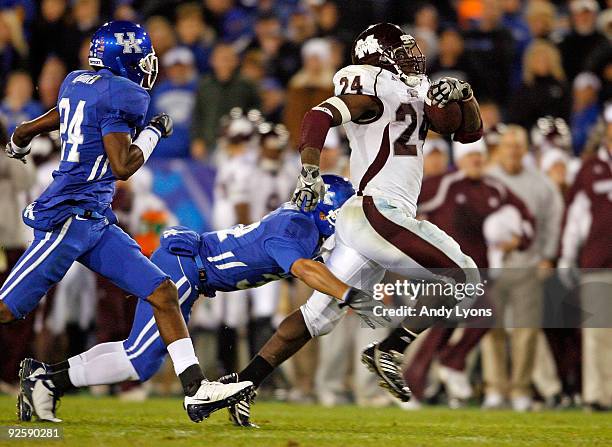 Anthony Dixon of the Mississippi State Bulldogs runs with the ball during the SEC game against the Kentucky Wildcats at Commonwealth Stadium on...