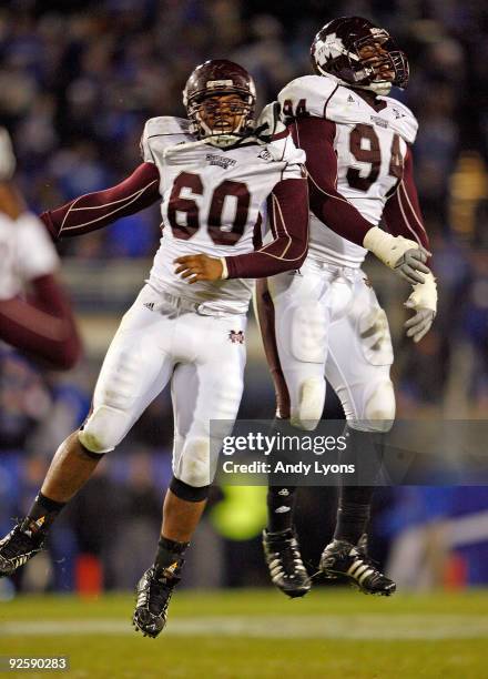 Devin Jones and Fletcher Cox of the Mississippi State Bulldogs celebrates after stopping the Kentucky Wildcats on fourth down on their last series of...