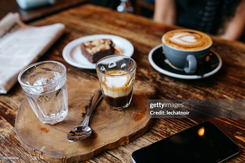 High angle view of coffee and cake on the table in a cafe in London downtown
