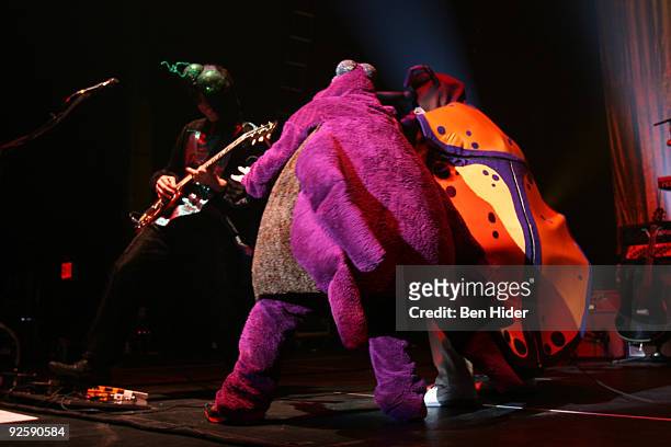 Guitarist Brian Bell, Singer Rivers Cuomo and bassist Mikey Welsh of Weezer perform at the MetroPCS Masquerade at Hammerstein Ballroom on October 31,...