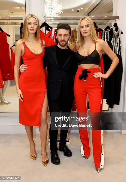 Kristina Romanova, David Koma and Masha Markova Hanson attend the David Koma SS18 collection presentation at 29 Lowndes on February 28, 2018 in...