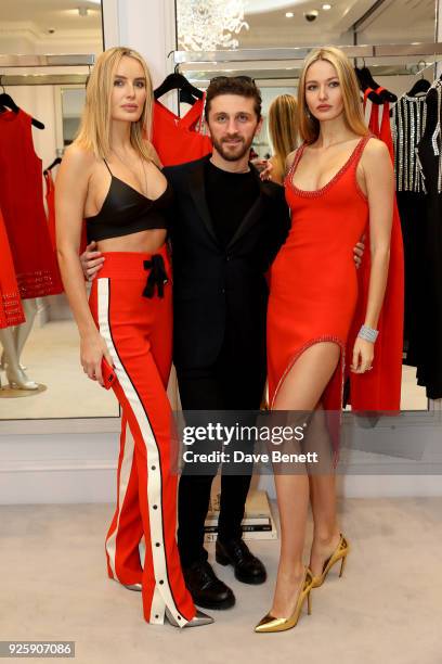 Masha Markova Hanson, David Koma and Kristina Romanova attend the David Koma SS18 collection presentation at 29 Lowndes on February 28, 2018 in...