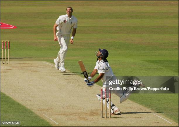 Mahendra Singh Dhoni of India hits a delivery from Chris Tremlett of England during the 3rd Test match between England and India at The Oval, London,...