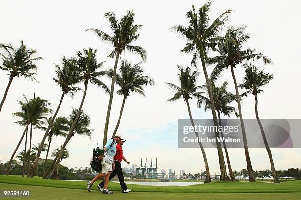 Graeme McDowell of Northern Ireland walks down the 4th hole during Round Four of the Barclays Singapore Open at Sentosa Golf Club on November 1, 2009...