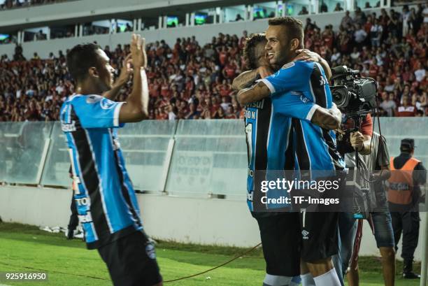 Luan Vieira of Gremio celebrates after scoring his team`s first goal with team mates during the first leg match between Independiente and Gremio as...