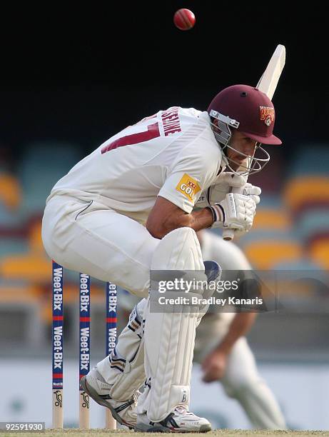 Lee Carseldine of the Bulls ducks under a bouncer during day one of the Sheffield Shield match between the Queensland Bulls and the Tasmanian Tigers...