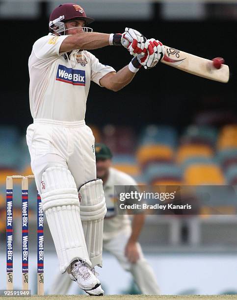 Chris Hartley of the Bulls plays a shot during day one of the Sheffield Shield match between the Queensland Bulls and the Tasmanian Tigers at The...