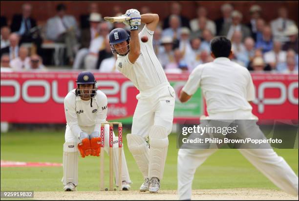 Michael Vaughan of England drives a delivery from Anil Kumble of India during the 1st Test match between England and India at Lord's Cricket Ground,...