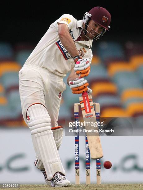 Glen Batticciotto of the Bulls drives the ball during day one of the Sheffield Shield match between the Queensland Bulls and the Tasmanian Tigers at...