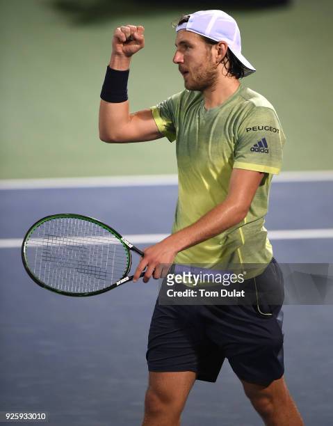 Lucas Pouille of France celebrates winning his quarter final match against Yuichi Sugita of Japan on day four of the ATP Dubai Duty Free Tennis...