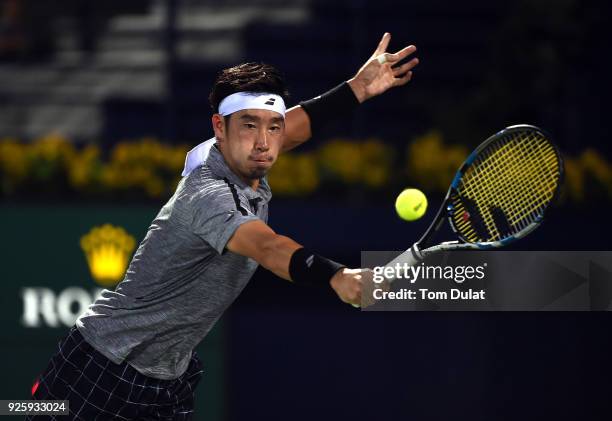 Yuichi Sugita of Japan plays a backhand during his quarter final match against Lucas Pouille of France on day four of the ATP Dubai Duty Free Tennis...