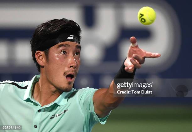 Yuichi Sugita of Japan serves during his quarter final match against Lucas Pouille of France on day four of the ATP Dubai Duty Free Tennis...