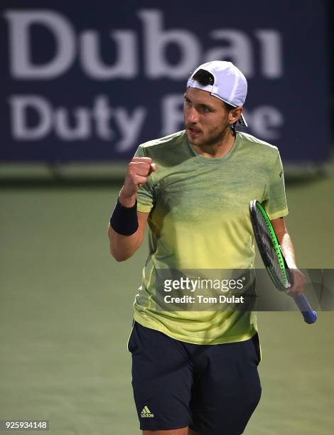 Lucas Pouille of France celebrates a point during his quarter final match against Yuichi Sugita of Japan on day four of the ATP Dubai Duty Free...