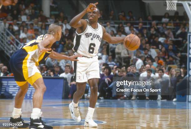 Avery Johnson of the San Antonio Spurs dribbles the ball against the Indiana Pacers during an NBA basketball game circa 1992 at the HemisFair Arena...