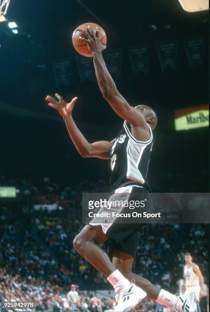 Avery Johnson of the San Antonio Spurs goes in for a layup against the Washington Bullets during an NBA basketball game circa 1995 at the US Airways...