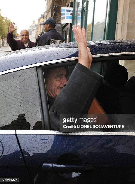 Former French president Jacques Chirac gestures as he arrives at his Paris apartment on November 1, 2009. Chirac will be the first former French...