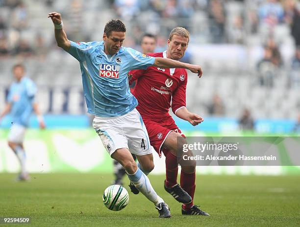 Torben Hoffmann of Muenchen battles for the ball with Adam Nemec of Kaiserslautern during the Second Bundesliga match between 1860 Muenchen and 1. FC...